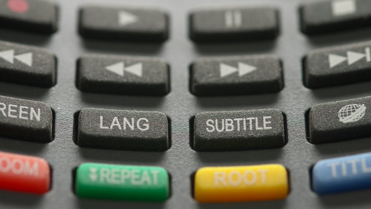 A TV remote with a subtitle button