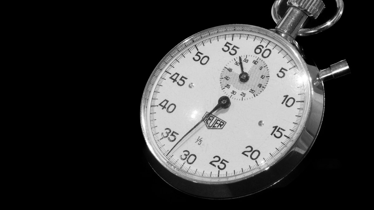 A stopwatch on a black background